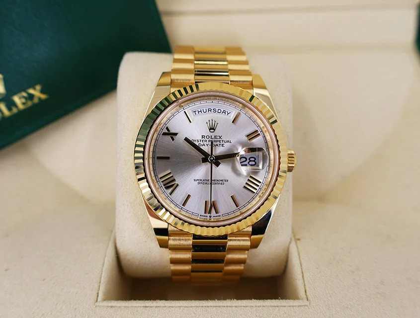 Rolex Day-Date 40 Yellow Gold Silver Roman Dial & Fluted Bezel President Bracelet 228238 –