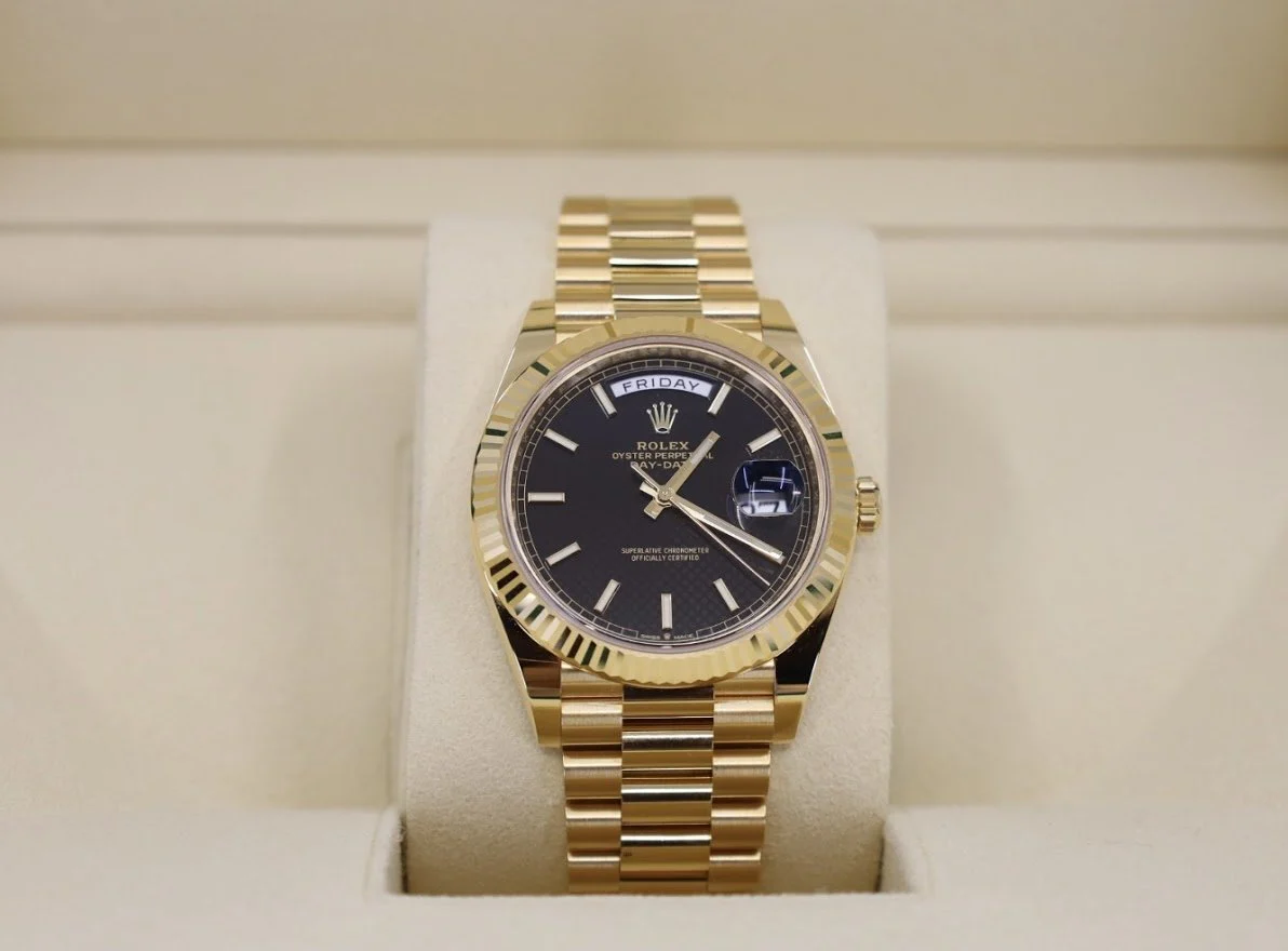 Rolex Day-Date 40 Yellow Gold Black Diagonal Motif Index Dial & Fluted Bezel President Bracelet 228238 –