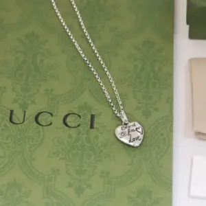 Necklace with heart shaped pendant