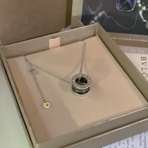 Bvlgari classic small red person necklace