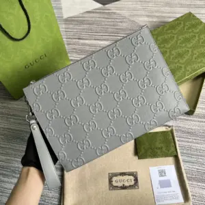 Leather handbag with GG pattern embossing
