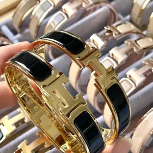 Hermes H gold black large arm ring