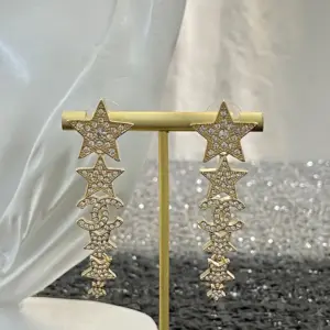 CHANEL 23K Star and Fringe Earrings