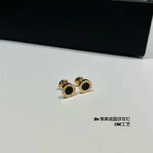 Black ceram€ round disc stud earrings