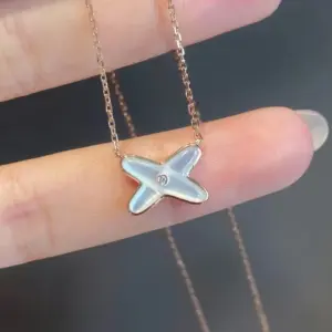 Cross mother-of-pearl necklace with 18k gold