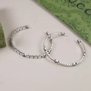 Dually interlocking silver bracelet pair