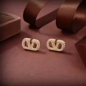 Valentino half pearl half diamond earring