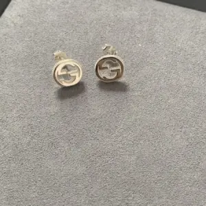 Pure silver interlocking g stud earrings