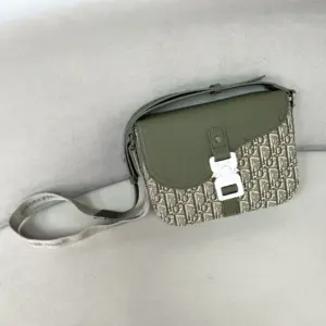 Saddle messenger bag with crocodile leather