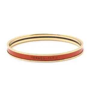 Narrow enamel bracelet with gold rim and orange color numbered 0001553211