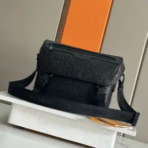 Voyager small messenger bag in monogram shadow leather