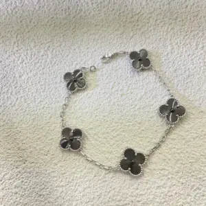 VCA laser-engraved black and white four-leaf bracelet