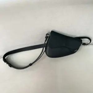 Mini saddle bag with oblique black print
