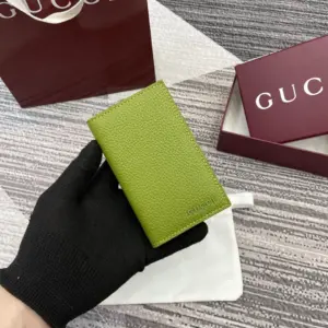 Green bifold wallet with Gucci logo